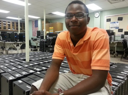 Student Vice Chair Dennis Bacon Takes a Break After a Busy Summer Day Refurbishing Computers
